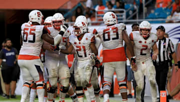 MIAMI GARDENS, FL - OCTOBER 21: Moe Neal #21 of the Syracuse Orange celebrates a touchdown during a game against the Miami Hurricanes at Sun Life Stadium on October 21, 2017 in Miami Gardens, Florida. (Photo by Mike Ehrmann/Getty Images)