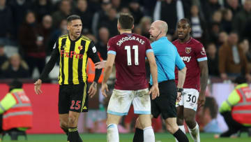 LONDON, ENGLAND - DECEMBER 22: Jose Holebas of Watford clashes with Robert Snodgrass of West Ham United as referee Lee Mason attempts to calm the two down during the Premier League match between West Ham United and Watford FC at London Stadium on December 22, 2018 in London, United Kingdom. (Photo by Christopher Lee/Getty Images)