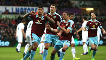 SWANSEA, WALES - MARCH 04: Andre Gray of Burnley celebrates scoring his sides first goal with his Burnley team mates during the Premier League match between Swansea City and Burnley at Liberty Stadium on March 4, 2017 in Swansea, Wales. (Photo by Ben Hoskins/Getty Images)