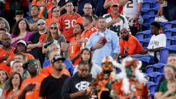 DURHAM, NC - SEPTEMBER 29: Fans of the Miami Hurricanes sit down during the playing of the National Anthem before their game against the Duke Blue Devils at Wallace Wade Stadium on September 29, 2017 in Durham, North Carolina. (Photo by Streeter Lecka/Getty Images)