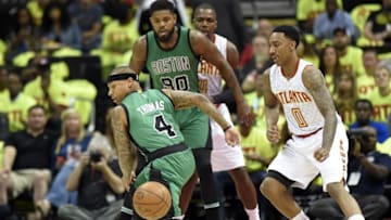 Apr 16, 2016; Atlanta, GA, USA; Boston Celtics guard Isaiah Thomas (4) looses control of the ball against the Atlanta Hawks during the first half in game one of the first round of the NBA Playoffs at Philips Arena. Mandatory Credit: John David Mercer-USA TODAY Sports