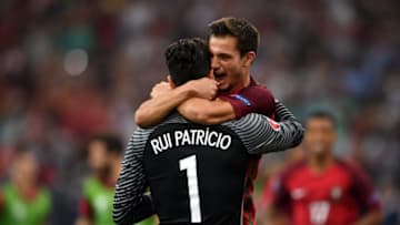 MARSEILLE, FRANCE - JUNE 30: Rui Patricio (L) of Portugal is congratulated by his team mate Cedric Soares (R) after their team's win through the penalty shootout in the UEFA EURO 2016 quarter final match between Poland and Portugal at Stade Velodrome on June 30, 2016 in Marseille, France. (Photo by Laurence Griffiths/Getty Images)