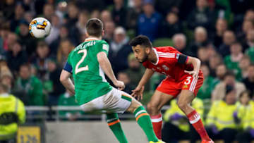 Seamus Coleman of Ireland and Neil Taylor of Wales fight for the ball during the 2018 FIFA World Cup Qualifying Round Group D match between Republic of Ireland and Wales at Aviva Stadium in Dublin on March 24, 2017 (Photo by Andrew Surma/NurPhoto via Getty Images)