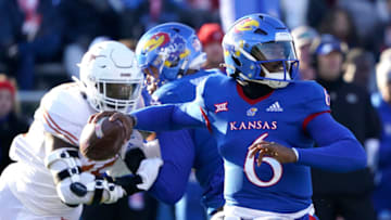 LAWRENCE, KANSAS - NOVEMBER 19: Quarterback Jalon Daniels #6 of the Kansas Jayhawks passes against the Texas Longhorns first half at David Booth Kansas Memorial Stadium on November 19, 2022 in Lawrence, Kansas. (Photo by Ed Zurga/Getty Images)