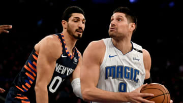 NEW YORK, NY - NOVEMBER 11: Nikola Vucevic #9 of the Orlando Magic dribbles past Enes Kanter #00 of the New York Knicks during the game at Madison Square Garden on November 11, 2018 in New York City. NOTE TO USER: User expressly acknowledges and agrees that, by downloading and or using this photograph, User is consenting to the terms and conditions of the Getty Images License Agreement. (Photo by Sarah Stier/Getty Images)