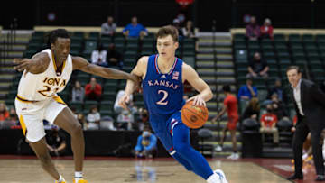Nov 28, 2021; Orlando, FL, USA; Kansas Jayhawks guard Christian Braun (2) dribbles the ball against the Iona Gaels in the second half at HP Field House. Mandatory Credit: Jeremy Reper-USA TODAY Sports