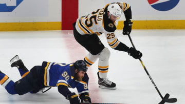 ST. LOUIS, MO - JUNE 9: Boston Bruins Brandon Carlo gets the puck away from Blues Ryan O'Reilly in the 1st period. The St. Louis Blues host the Boston Bruins in Game 6 of the 2019 Stanley Cup Finals at Enterprise Center in St. Louis on June 9, 2019. (Photo by John Tlumacki/The Boston Globe via Getty Images)