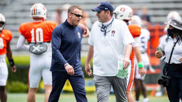 Auburn head coach Bryan Harsin and Auburn offensive coordinator Mike Bobo during warm ups before Auburn football A-Day spring game at Jordan-Hare Stadium in Auburn, Ala., on Saturday, April 17, 2021.