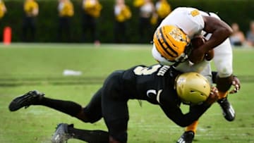 Wofford's Jaheem Hazel takes down Kennesaw State's Xavier Shepherd. Spartanburg Herald-Journal.