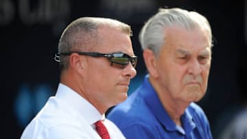 KANSAS CITY, MO - AUGUST 9: Kansas City Royals general manager Dayton Moore and owner David Glass talk during batting practice prior to a game against the Chicago White Sox at Kauffman Stadium on August 9, 2016 in Kansas City, Missouri. (Photo by Ed Zurga/Getty Images)