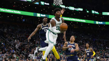 Mar 3, 2022; Boston, Massachusetts, USA; Boston Celtics guard Marcus Smart (36) drives under the basket past Memphis Grizzlies forward Jaren Jackson Jr. (13) during the first quarter at TD Garden. Mandatory Credit: Winslow Townson-USA TODAY Sports