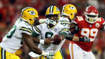 KANSAS CITY, MO - AUGUST 30: quarterback DeShone Kizer #9 of the Green Bay Packers hands off to running back Aaron Jones #33 during the 1st quarter of the preseason game against the Kansas City Chiefs at Arrowhead Stadium on August 30, 2018 in Kansas City, Missouri. (Photo by Jamie Squire/Getty Images)