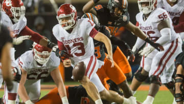 Auburn footballNov 27, 2021; Stillwater, Oklahoma, USA; Oklahoma State Cowboys safety Thomas Harper (13) knocks the ball away from Oklahoma Sooners quarterback Caleb Williams (13) during the third quarter at Boone Pickens Stadium. Oklahoma State won 37-33. Mandatory Credit: Brett Rojo-USA TODAY Sports
