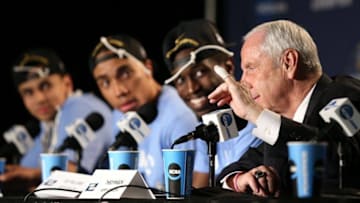 Mar 27, 2016; Philadelphia, PA, USA; North Carolina Tar Heels head coach Roy Williams shows his cut that occurred when cutting down the net during a press conference after defeating the Notre Dame Fighting Irish in the championship game in the East regional of the NCAA Tournament at Wells Fargo Center. North Carolina won 88-74. Mandatory Credit: Bill Streicher-USA TODAY Sports