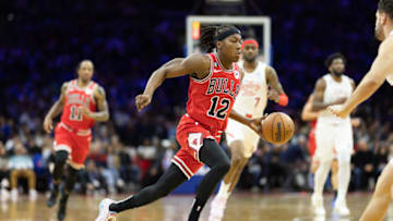Mar 20, 2023; Philadelphia, Pennsylvania, USA; Chicago Bulls guard Ayo Dosunmu (12) drives against the Philadelphia 76ers during the third quarter at Wells Fargo Center. Mandatory Credit: Bill Streicher-USA TODAY Sports