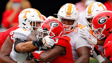 ATHENS, GEORGIA - OCTOBER 10: Aubrey Solomon #98 and Tyler Baron #9 of the Tennessee Volunteers tackle Zamir White #3 of the Georgia Bulldogs during the first half at Sanford Stadium on October 10, 2020 in Athens, Georgia. (Photo by Kevin C. Cox/Getty Images)
