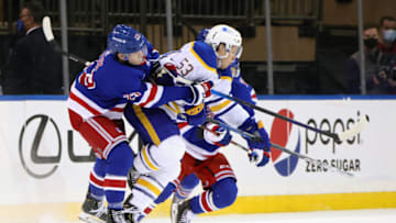 Mar 22, 2021; New York, New York, USA; New York Rangers defenseman Adam Fox (23) hits Buffalo Sabres left wing Jeff Skinner (53) during the third period at Madison Square Garden. Mandatory Credit: Bruce Bennett/POOL PHOTOS-USA TODAY Sports