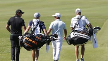 Jan 7, 2016; Maui, HI, USA; PGA golfers Jason Day and Rickie Fowler walk down the first fairway during the first round of the Hyundai Tournament of Champions golf tournament at Kapalua Resort - The Plantation Course. Mandatory Credit: Brian Spurlock-USA TODAY Sports