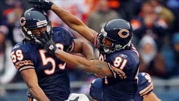 Dec 4, 2011; Chicago, IL, USA; Chicago Bears linebacker Patrick Trahan (59) and wide receiver Sam Hurd (81) celebrate Trahan