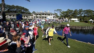 Apr 17, 2016; Hilton Head, SC, USA; Jason Day walks with his caddie Colin Swatton after Day