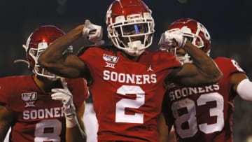 NORMAN, OK - NOVEMBER 9: Wide receiver CeeDee Lamb #2 of the Oklahoma Sooners celebrates his touchdown on a 63-yard pass and run with wide receivers Trejan Bridges #8 and Nick Basquine #83 in the game against the Iowa State Cyclones on November 9, 2019 at Gaylord Family Oklahoma Memorial Stadium in Norman, Oklahoma. The Sooners lead 35-14 at the half. (Photo by Brian Bahr/Getty Images)
