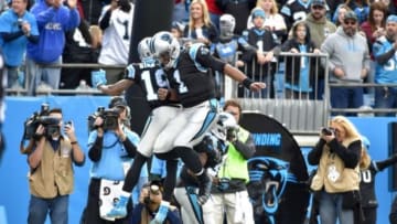 Nov 22, 2015; Charlotte, NC, USA; Carolina Panthers quarterback Cam Newton (1) celebrates a touchdown with wide receiver Ted Ginn (19) and fullback Mike Tolbert (35) in the first quarter at Bank of America Stadium. Mandatory Credit: Bob Donnan-USA TODAY Sports