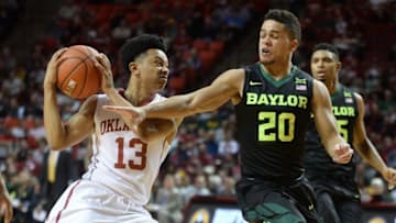 Dec 30, 2016; Norman, OK, USA; Oklahoma Sooners guard Jordan Shepherd (13) drives to the basket in front of Baylor Bears guard Manu Lecomte (20) during the second half at Lloyd Noble Center. Mandatory Credit: Mark D. Smith-USA TODAY Sports