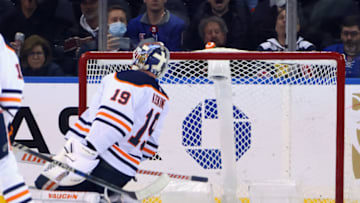 NEW YORK, NEW YORK - JANUARY 03: Mikko Koskinen #19 of the Edmonton Oilers is beaten by Ryan Strome #16 of the New York Rangers during the third period at Madison Square Garden on January 03, 2022 in New York City. The Rangers defeated the Oilers 4-1. (Photo by Bruce Bennett/Getty Images)