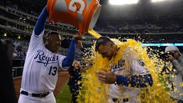 Sep 28, 2016; Kansas City, MO, USA; Kansas City Royals catcher Salvador Perez (13) pours the water cooler on right fielder Paulo Orlando (16) after the game against the Minnesota Twins at Kauffman Stadium. Kansas City won 5-2. Mandatory Credit: John Rieger-USA TODAY Sports
