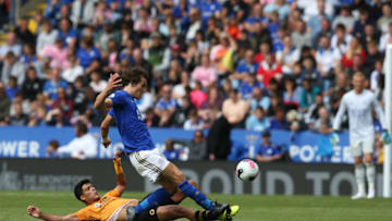 LEICESTER, ENGLAND - AUGUST 11: Leicester City's Caglar Soyuncu is tackled by Wolverhampton Wanderers' Raul Jimenez during the Premier League match between Leicester City and Wolverhampton Wanderers at The King Power Stadium on August 11, 2019 in Leicester, United Kingdom. (Photo by Stephen White - CameraSport/Getty Images)