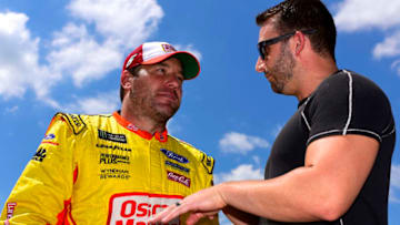 DARLINGTON, SOUTH CAROLINA - AUGUST 31: Ryan Newman, driver of the #6 Oscar Mayer/Velveeta Ford, and Matt DiBenedetto, driver of the #95 IMSA GTO Throwback Toyota, speak during qualifying for the Monster Energy NASCAR Cup Series Bojangles' Southern 500 at Darlington Raceway on August 31, 2019 in Darlington, South Carolina. (Photo by Jared C. Tilton/Getty Images)