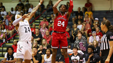 LAHAINA, HI - NOVEMBER 23: JaeLyn Withers #24 of the Louisville Cardinals shoots over Jeremiah Davenport #24 of the Cincinnati Bearcats in the first half of the game during the Maui Invitational at Lahaina Civic Center on November 23, 2022 in Lahaina, Hawaii. (Photo by Darryl Oumi/Getty Images)