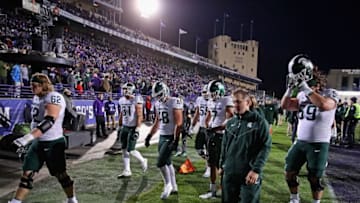 EVANSTON, IL - OCTOBER 28: Members of the Michigan State Spartans walk off of the field after a loss to the Northwestern Wildcats at Ryan Field on October 28, 2017 in Evanston, Illinois. Northwestern defeated Michigan State 39-31 in triple overtime.(Photo by Jonathan Daniel/Getty Images)