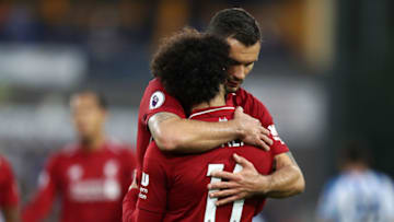 HUDDERSFIELD, ENGLAND - OCTOBER 20: Mohamed Salah of Liverpool(back) celebrates after scoring his sides first goal with Dejan Lovren of Liverpool during the Premier League match between Huddersfield Town and Liverpool FC at John Smith's Stadium on October 20, 2018 in Huddersfield, United Kingdom. (Photo by Mark Robinson/Getty Images)