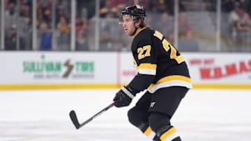Dec 5, 2019; Boston, MA, USA; Boston Bruins defenseman John Moore (27) controls the blue line during the first period against the Chicago Blackhawks at TD Garden. Mandatory Credit: Bob DeChiara-USA TODAY Sports