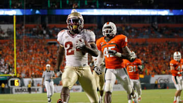 MIAMI, FL - OCTOBER 9: Lonnie Pryor #24 of the Florida State Seminoles scores a touchdown while being pursued by Ramon Buchanan #45 of the Miami Hurricanes on October 9, 2010 at Sun Life Stadium in Miami, Florida. The Seminoles defeated the Hurricanes 45-17. (Photo by Joel Auerbach/Getty Images)