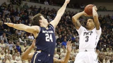 Jan 31, 2015; Pittsburgh, PA, USA; Pittsburgh Panthers guard Cameron Wright (3) shoots against Notre Dame Fighting Irish guard Pat Connaughton (24) during the first half at the Petersen Events Center. Mandatory Credit: Charles LeClaire-USA TODAY Sports
