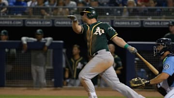 PEORIA, ARIZONA - MARCH 06: Sheldon Neuse #64 of the Oakland Athletics hits a ground rule double against the Seattle Mariners during the spring training game at Peoria Stadium on March 06, 2019 in Peoria, Arizona. (Photo by Jennifer Stewart/Getty Images)