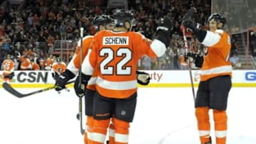 Oct 29, 2015; Philadelphia, PA, USA; Philadelphia Flyers defenseman Luke Schenn (22) celebrates his goal with center Chris VandeVelde (76) and center Vincent Lecavalier (40) against the New Jersey Devils during the second period at Wells Fargo Center. Mandatory Credit: Eric Hartline-USA TODAY Sports
