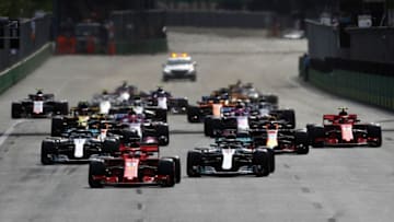 BAKU, AZERBAIJAN - APRIL 29: Sebastian Vettel of Germany driving the (5) Scuderia Ferrari SF71H leads Lewis Hamilton of Great Britain driving the (44) Mercedes AMG Petronas F1 Team Mercedes WO9 and the rest of the field at the start during the Azerbaijan Formula One Grand Prix at Baku City Circuit on April 29, 2018 in Baku, Azerbaijan. (Photo by Mark Thompson/Getty Images)