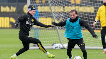 DORTMUND, GERMANY - DECEMBER 11: (BILD ZEITUNG OUT) Lukasz Piszczek of Borussia Dortmund and Mario Goetze of Borussia Dortmund battle for the ball during the training session of Borussia Dortmund on December 11, 2019 in Dortmund, Germany. (Photo by TF-Images/Getty Images)