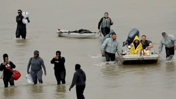 HOUSTON, TX - AUGUST 29: Residents are evacuated from their homes after severe flooding following Hurricane Harvey in north Houston August 29, 2017 in Houston, Texas. Parts of southeast Texas have received more than 40 inches of rain since Harvey made landfall on Friday, with more torrential rain expected the next several days. (Photo by Win McNamee/Getty Images)