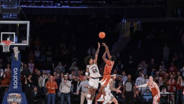 Nov 19, 2023; New York, New York, USA; Texas Longhorns guard Max Abmas (3) scores the game winning basket as Louisville Cardinals guard Skyy Clark (55) defends during the second half at Madison Square Garden. Mandatory Credit: Vincent Carchietta-USA TODAY Sports