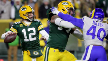 Green Bay Packers offensive tackle Billy Turner (77) blocks Los Angeles Rams outside linebacker Von Miller (40) while quarterback Aaron Rodgers (12) throws downfield during their game Sunday, November 28, 2021 at Lambeau Field in Green Bay, Wis. The Green Bay Packers beat the Los Angeles Rams 36-28.Packers29 25