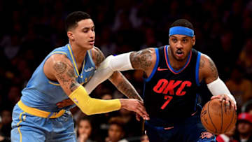 LOS ANGELES, CA - JANUARY 03: Carmelo Anthony #7 of the Oklahoma City Thunder drives on Kyle Kuzma #0 of the Los Angeles Lakers during the first half at Staples Center on January 3, 2018 in Los Angeles, California. (Photo by Harry How/Getty Images)