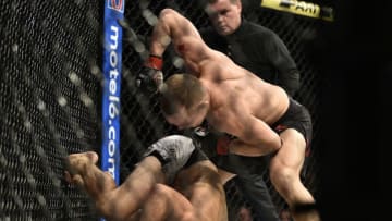 LAS VEGAS, NEVADA - DECEMBER 14: Petr Yan of Russia strikes Urijah Faber in their bantamweight bout during the UFC 245 event at T-Mobile Arena on December 14, 2019 in Las Vegas, Nevada. (Photo by Chris Unger/Zuffa LLC)