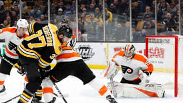 BOSTON, MA - JANUARY 31: Boston Bruins center Patrice Bergeron (37) tries to get at the puck during a game between the Boston Bruins and the Philadelphia Flyers on January 31, 2019, at TD Garden in Boston, Massachusetts. (Photo by Fred Kfoury III/Icon Sportswire via Getty Images)