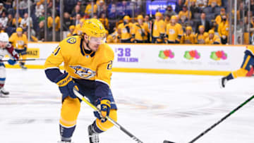 Jan 11, 2022; Nashville, Tennessee, USA; Nashville Predators center Nick Cousins (21) skates against the Colorado Avalanche during the first period at Bridgestone Arena. Mandatory Credit: Steve Roberts-USA TODAY Sports