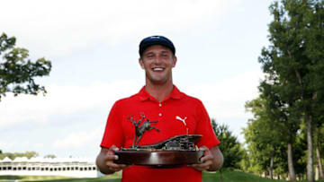 Bryson DeChambeau poses with the championship trophy following the final round of the John Deere Classic at TPC Deere Run on July 16, 2017 in Silvis, Illinois. (Photo by Stacy Revere/Getty Images)