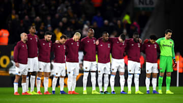 WOLVERHAMPTON, ENGLAND - JANUARY 29: The West Ham United team take part in a minute of silence in tribute to Emiliano Sala prior to the Premier League match between Wolverhampton Wanderers and West Ham United at Molineux on January 29, 2019 in Wolverhampton, United Kingdom. (Photo by Clive Mason/Getty Images)